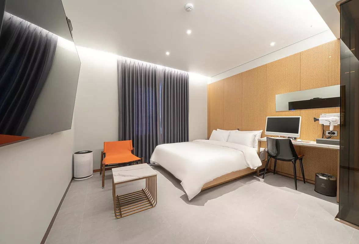 Sleek Workspace and Inviting Bed