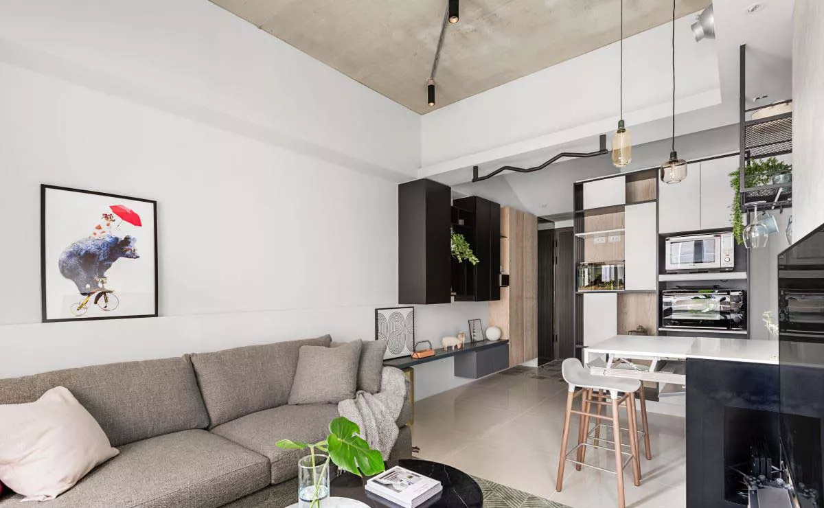 serviced apartment living room sofa TV wall and kitchen